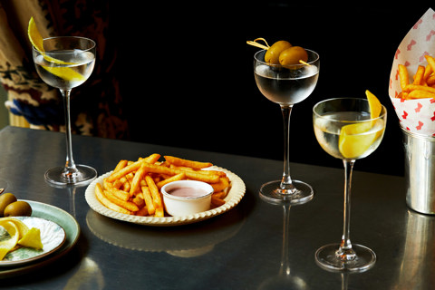 Martini Hour at Brasserie Max. A table of martinis and fries on a table