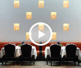 A Martha Freud art instillation at Ham Yard Restaurant. Overlaid on the image is a play button icon.