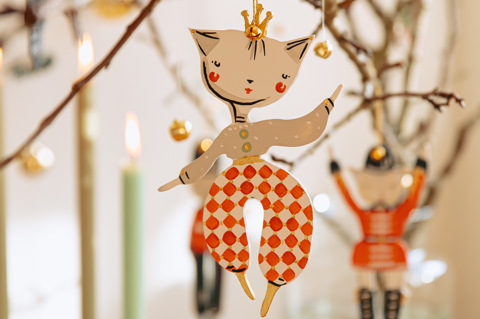 A Christmas decoration by Alice Mary Lynch hanging on a small branch