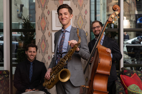 The Sam Taylor Trio stand in the bar at The Whitby Hotel in New York