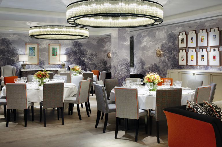 Round dining tables set-up in the Windmill private events room at Ham Yard Hotel