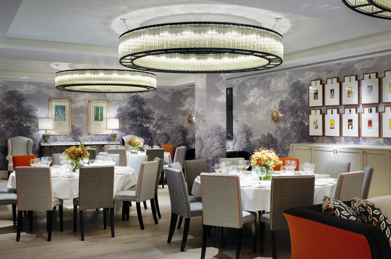 Round dining tables set-up in the Windmill private events room at Ham Yard Hotel