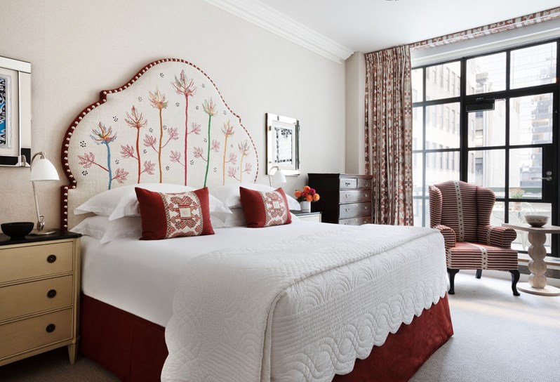 A floral embroidered onion shape headboard bed