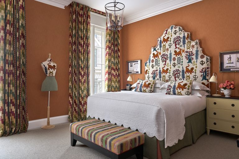 A side angle image of the bed in Deluxe Room, 109, at Haymarket Hotel.
