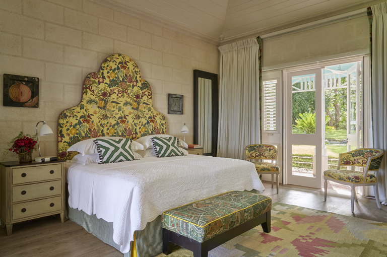 A diagonal image focusing on the bed, in bedroom 3. At Rossferry, the Carribean Property managed by Firmdale Hotels.