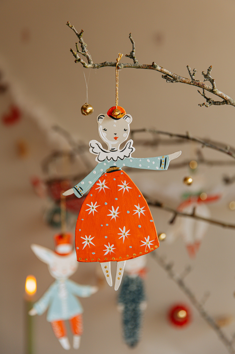 A Christmas decoration by Alice Mary Lynch hanging on a small branch