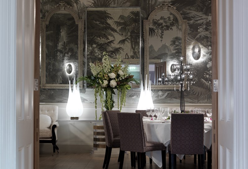 A view of a table set for dinner in the Shooting Gallery.