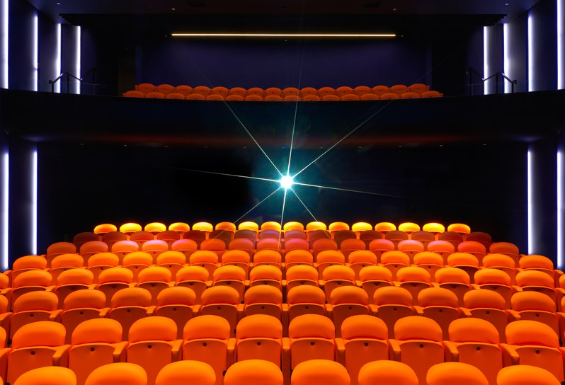 190 bright orange leather seats spread on upper circle and stalls in Ham Yard Hotel's state-of-the-art screening room.