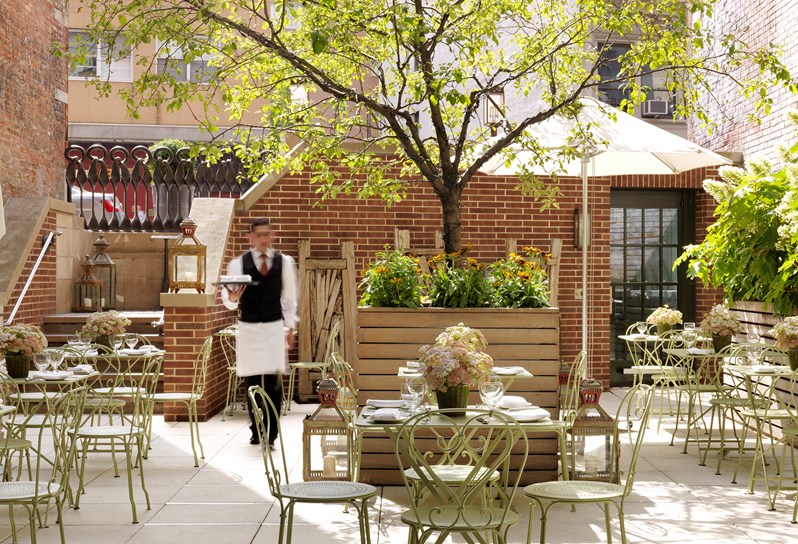 The light and airy outdoor Crosby Bar Terrace is ideal for warmer months with green tables and chairs, umbrellas and  leafy garden beds.  Dining is available all day long.