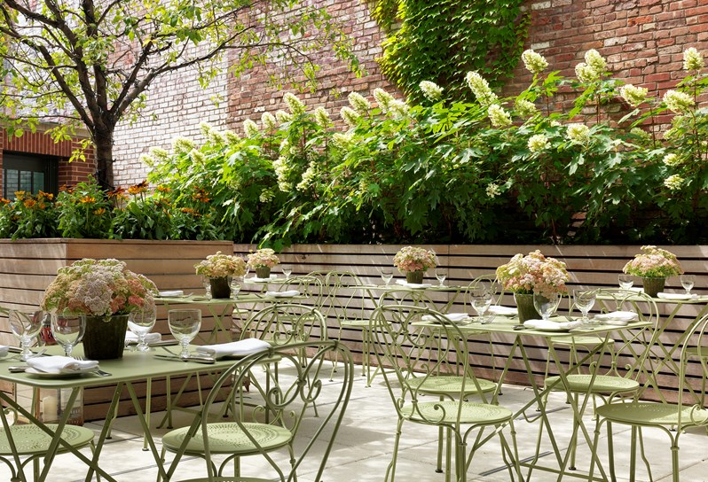 The light and airy outdoor Crosby Bar Terrace is ideal for warmer months with green tables and chairs, umbrellas and  leafy garden beds.  Dining is available all day long.