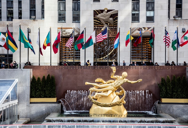 The fountain and world flags outside Rockefeller Center, located near The Whitby Hotel.