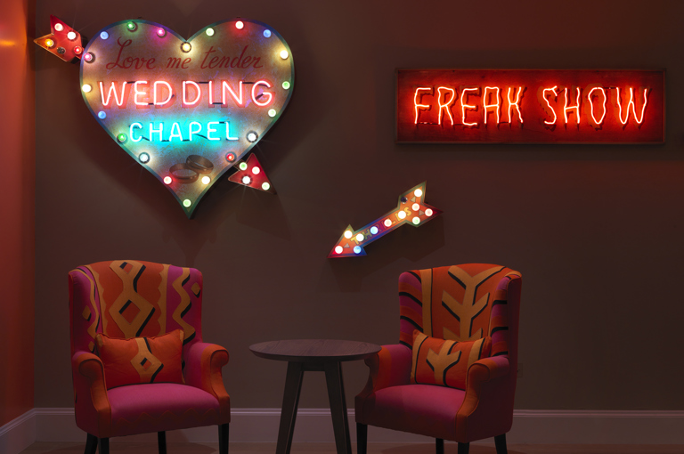 An image of the neon sign artwork in the private event space, The Dive Bar, at Ham Yard Hotel.