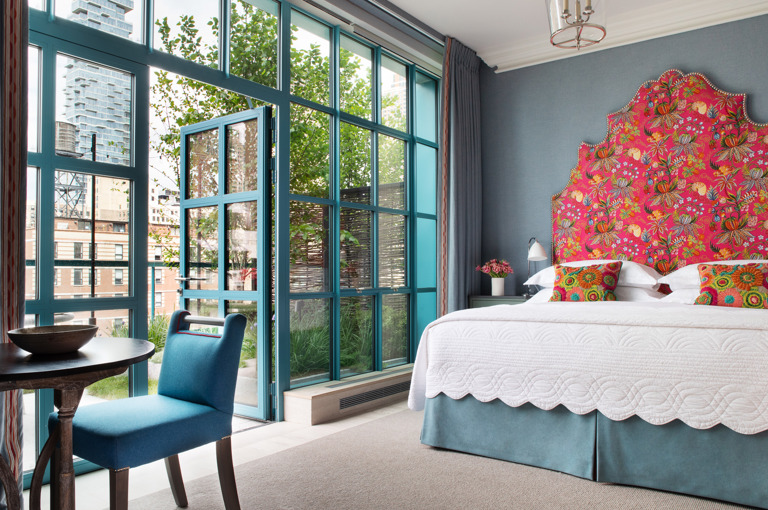 Diagonal shot of Junior Terrace Suite, 906 looking out onto the terrace at Warren Street Hotel