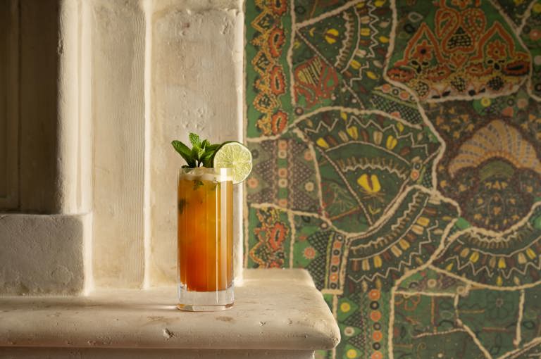 A wide angle close-up shot of one of the cocktails served in a highball glass at The Crosby Bar