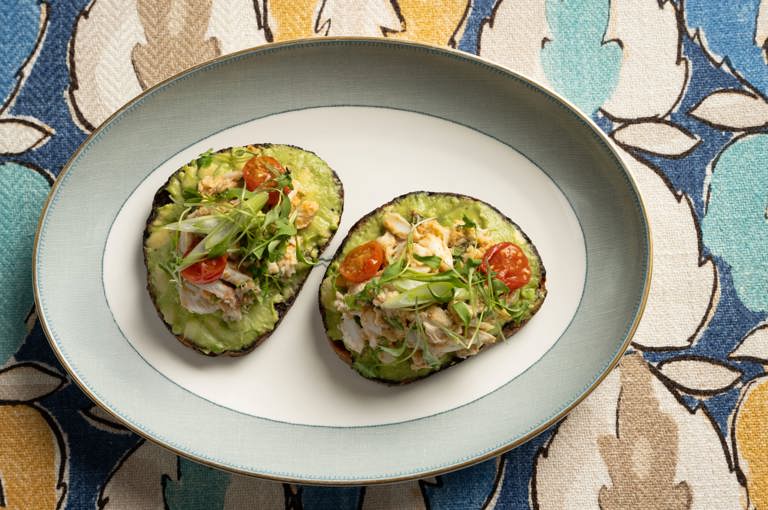 A wide close-up shot of the blue crab and avocado toast starter at The Whitby Bar