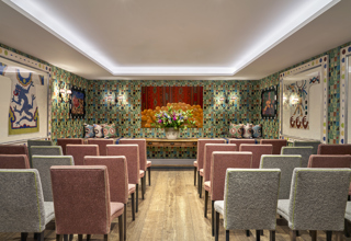 A back shot of a wedding style set-up in the Vanessa Bell private events room at Charlotte Street Hotel