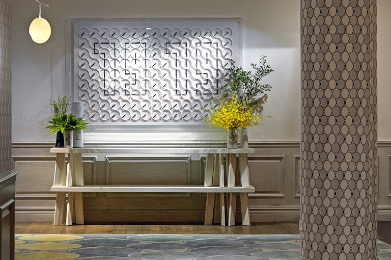 Close shot of the clock artwork in the private events lobby at Crosby Street Hotel