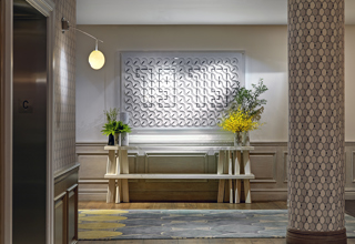 Close shot of the clock artwork in the private events lobby at Crosby Street Hotel