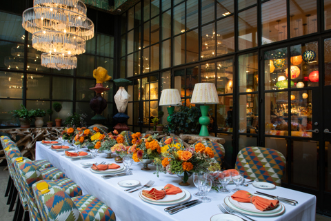 Image of a long table set up for lunch in The Orangery at Crosby Street Hotel.
