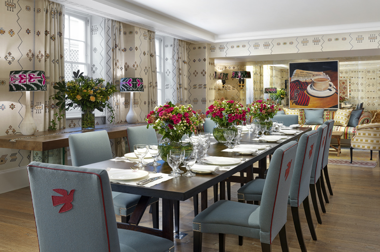 Day shot of a long dining table in the Rocklin private events room at Haymarket Hotel