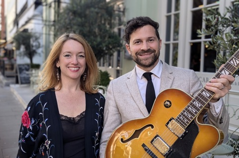 A wide angle shot of the two jazz singers, Mary Jane Lowe and Matt Redman outside Oscar Bar & Restaurant at Charlotte Street Hotel