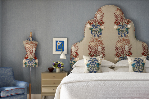 An image of the suite residence 5 in Ham Yard hotel, this image is being used in focus of the Mannequin, the mannequin sits to the left of the room in a sea inspired fabric. 