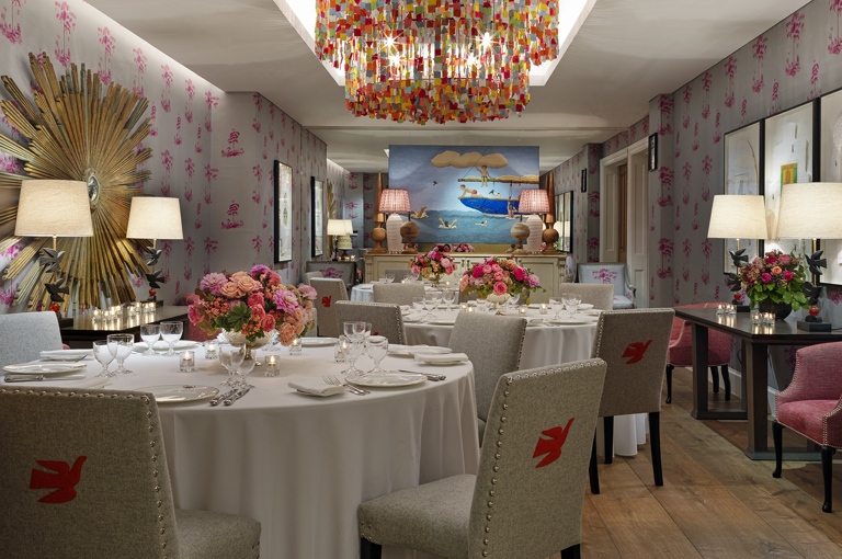 Round dining tables set-up in the Spring private events room at Crosby Street Hotel