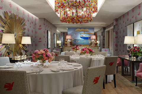 Round dining tables set-up in the Spring private events room at Crosby Street Hotel
