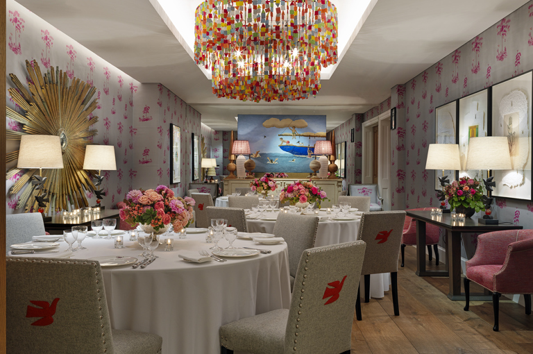 Round dining tables set-up in the Spring private events room at Crosby Street Hotel