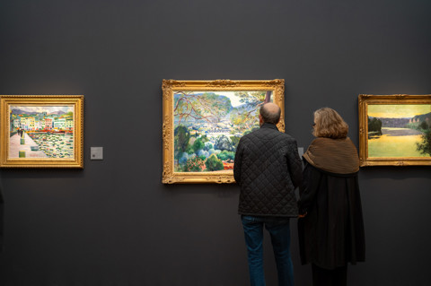 This image is of the inside the fair at frieze, in it we can see people looking at the art collections within the fair. this is being used to promote Ham Yards restaurant pop up with the art fair.