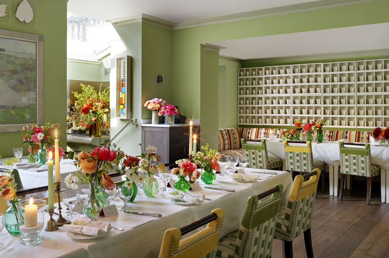 Diagonal shot long dining tables for a wedding set-up in the Potting Shed at Dorset Square Hotel