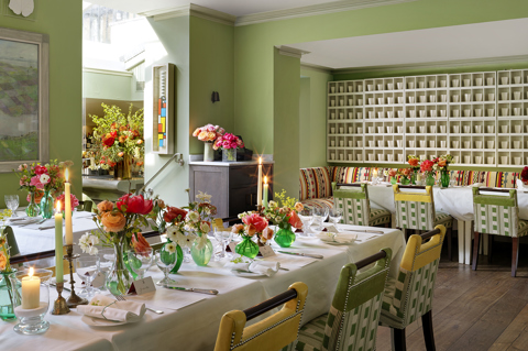 Diagonal shot long dining tables for a wedding set-up in the Potting Shed at Dorset Square Hotel