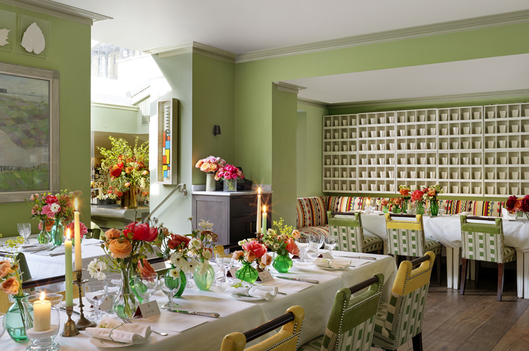 Diagonal shot long dining tables for a wedding set-up in the Potting Shed at Dorset Square Hotel