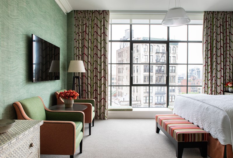 An image of the end of the bed in The Deluxe Room Top Floor, 1003, at Crosby Street Hotel.