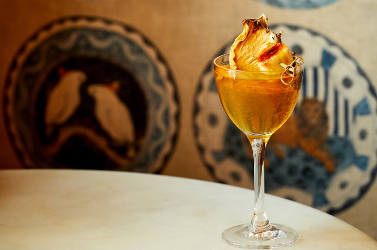 Close up shot of a yellow cocktail in The Whitby Bar in The Whitby Hotel