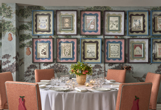 A close up portrait shot of a round private dining table set up in the Duncan Grant private events room at Charlotte Street Hotel