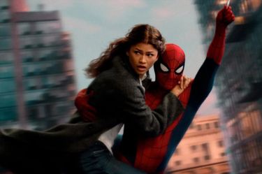 A still from 'Spider-Man: Brand New Day'. Spider-Man dressed in a red and blue superhero suit and mask swings by a web with a teenage girl grabbing on to him