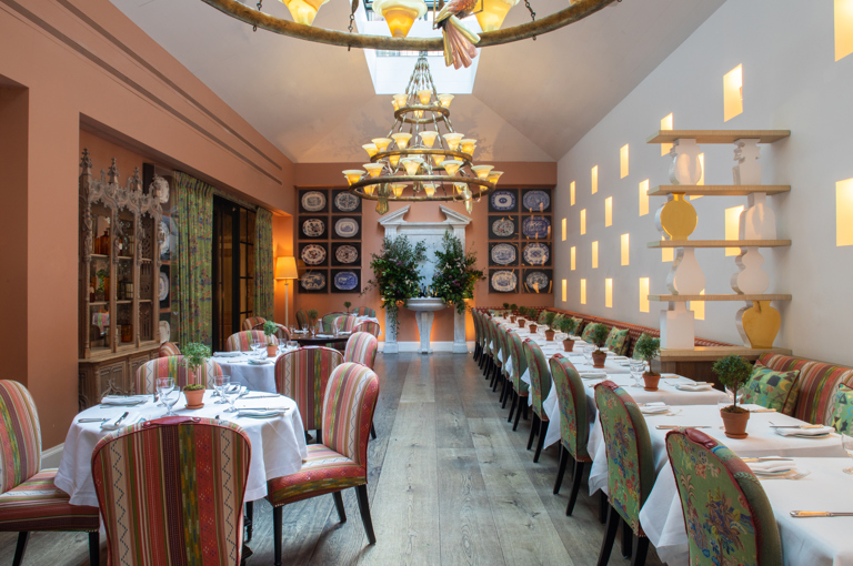 Both square and round dining tables set-up in the Orangery private events room at the Whitby Hotel