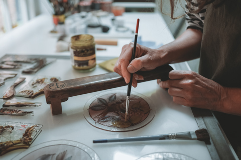 Flora Jamieson creating a stained glass piece in her studio