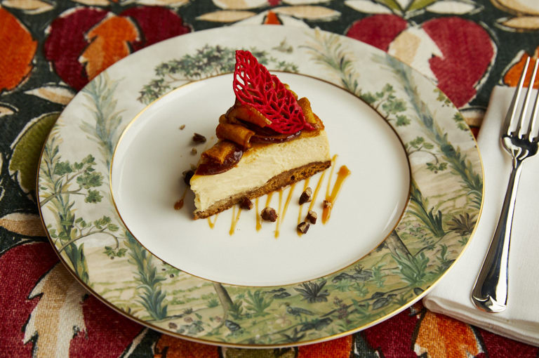 A landscape shot of a cheesecake on a plate at Brasserie Max