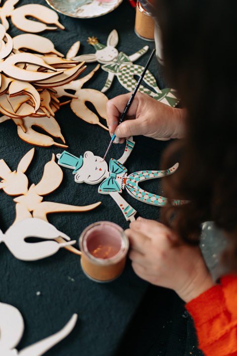 Christmas decorations being painted by Alice Mary Lynch
