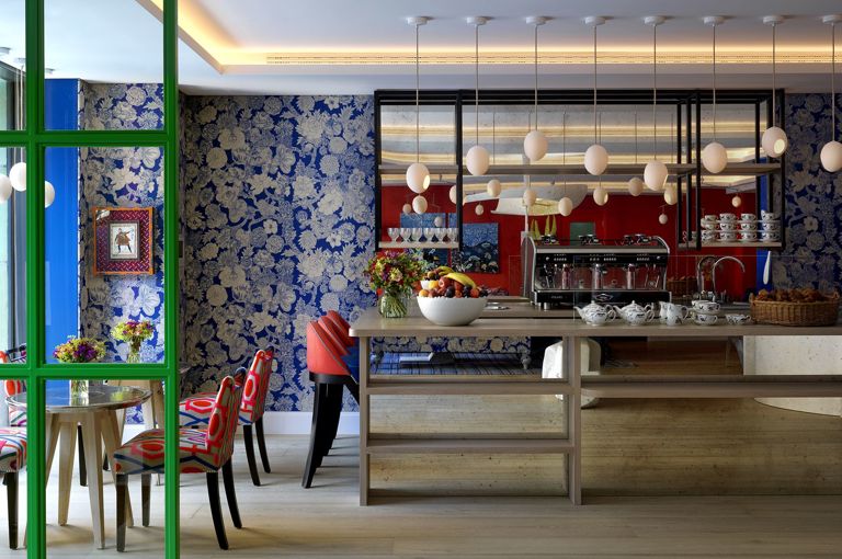 A wide shot he lobby reception area featuring a coffee bar and occassional seatingat 9-11 Richmond Buildings