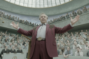 An film still from 'Digger' for the Firmdale November 2026  film club listings. The image shows Tom Hanks character standing with his hands raised and crowd around him. 
