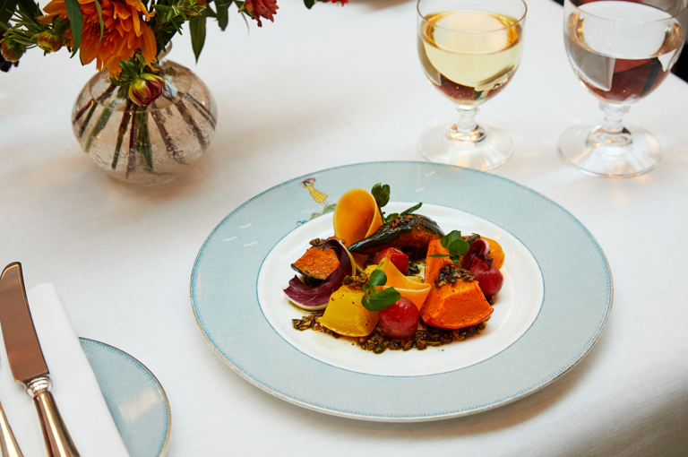 A main course of roast squash with lentils on a plate at Ham Yard