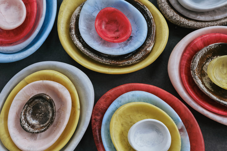 A shot from above of large colourful stone dishes of varying sizes grouped together from the Rock collection by Dinosaur Designs