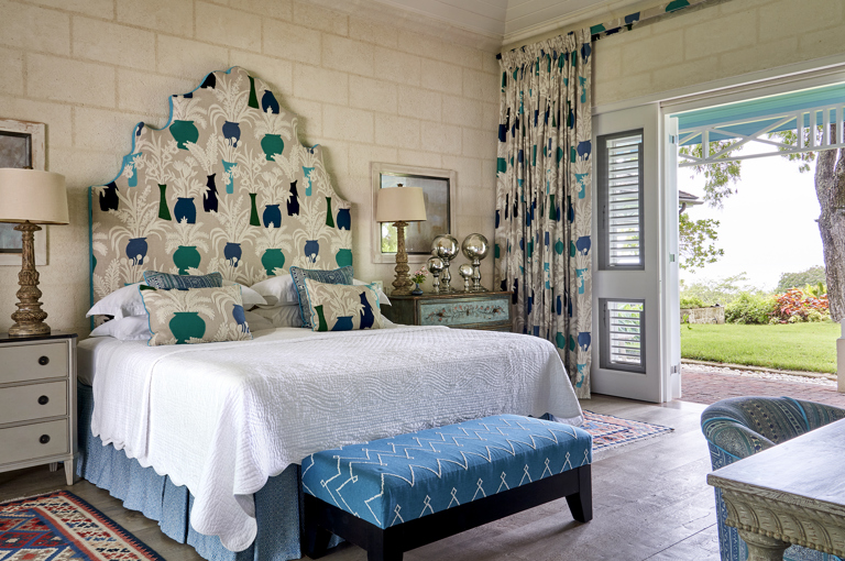 A diagonal image focusing on the bed, in bedroom 4. At Rossferry, the Carribean Property managed by Firmdale Hotels. 