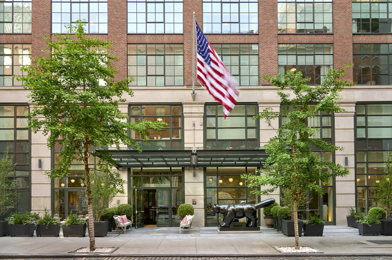 A wide angle shot of the exterior of Crosby Street Hotel