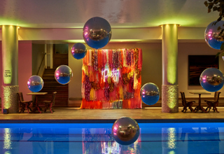 Side shot of large balloons above the Swimming pool private events room at Haymarket Hotel