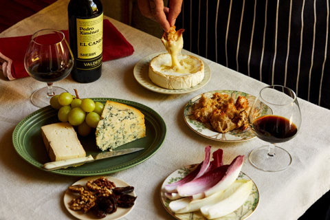 An image of a table with multiple different plates with cheeses at The Potting Shed, Dorset Square Hotel.