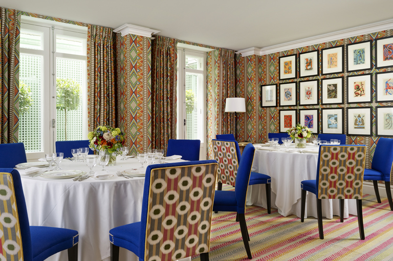 Round dining tables set-up in the Lyric private events room at Covent Garden Hotel